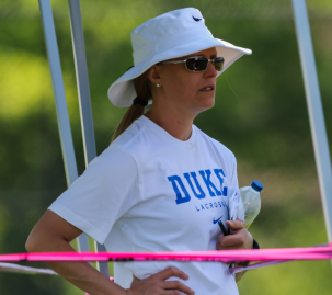 Duke women's lacrosse head coach, Kerstin Kimel, watches prospective student-athletes compete at the Nike Elite G8 girls lacrosse club tournament (2015).  Kimel was instrumental in passing the NCAA early recruiting legislation for lacrosse in 2017.  © Equ