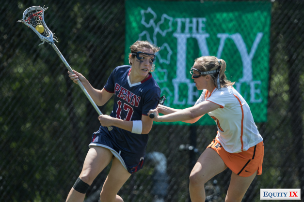 #17 Penn women's lacrosse attacker drives to goal against Princeton defender with green Ivy League sign in background at women's lacrosse championship © Equity IX - SportsOgram - Leigh Ernst Friestedt