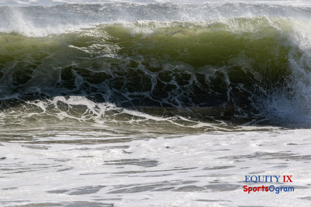 Wave crashes on the shore at Sagaponack during hurricane Ida with bubbles and white water rushing against green background of the water © Equity IX - SportsOgram - Leigh Ernst Friestedt