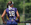 #18 Yellow Jackets girls lacrosse player in purple jersey with white headband, showcases for college coaches at club girls lacrosse tournament - early recruiting. © Equity IX - SportsOgram - Leigh Ernst Friestedt