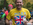 Mark Daly carries a bottle of water and has a big smile on his face as he runs in Central Park at 2017 NYC Marathon - Mark has his name displayed across his chest with a the Great Britain flag - © Equity IX - SportsOgram - Photo by Leigh Ernst Friestedt